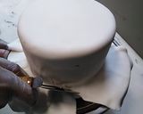 A picture of step 3 of Up in the clouds fondant Birthday cake.