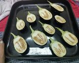 A picture of step 1 of Baingan Masala (Baked Aubergines).