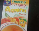 A picture of step 1 of Custard Powder Halwa cake mango flavour.