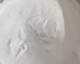 A picture of step 3 of Tiramisu with whipping cream.