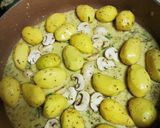 A picture of step 4 of Pork Chops with Honey, Soy Sauce, Mustard, and Lemon Baby Potatoes in a Dutch Oven.