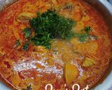 A picture of step 4 of Murgir Laal Jhol.