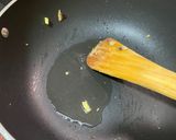 A picture of step 3 of Green Thai curry with steamed rice.