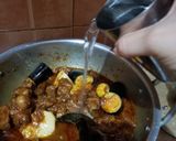 A picture of step 8 of Alo baingan gosht (mutton gravy).