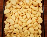 A picture of step 1 of Mike's 200 Clove Garlic Sun Dried Bagel Spread.