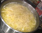 A picture of step 11 of Scratch Spaghetti and Cheese Stuffed Meatballs .