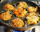 A picture of step 3 of Spicy cheesy healthy kuzhi appam with left over idli batter.