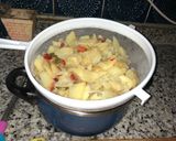 A picture of step 7 of Spanish Potato Omelette with Onion and Peppers.
