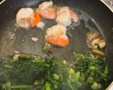 A picture of step 1 of Pan-Seared Scallops with Broccoli Rabe and Saffron Cream.