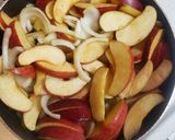 A picture of step 5 of Chicken breast on a bed of sauted apples and onions.
