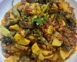 A picture of step 9 of Achari Aloo Baingan.