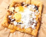 A picture of step 5 of Eggs And Coconut On SunDried Pesto Top Parmesan Puff Pizza.