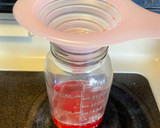 A picture of step 4 of Strawberry simple syrup.