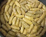 A picture of step 4 of Stuffed Grape Leaves with Pomegranate Molasses 🍇.