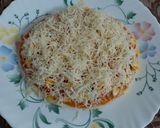 A picture of step 7 of Cheesy Mexican Veg Pizza.