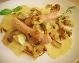 Foto del paso 14 de la receta Salchichas al vino blanco con alcachofas y champiñones