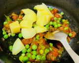 A picture of step 2 of Aloo Matar Chatpata Poha (Flattened rice with peas and potatoes).