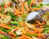A picture of step 4 of Veg Noddles with dry manchurian balls.