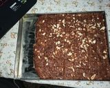 A picture of step 25 of Dodha Burfi with Daliya.