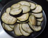 A picture of step 2 of Baigan bhaja.