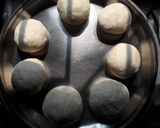 A picture of step 3 of Cheesy kulcha on tawa.