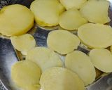 A picture of step 1 of Fried brinjals and potatoes.