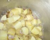 A picture of step 7 of Onion fried potatoes with fish and greens.