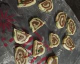 A picture of step 11 of Swiss roll tutti frutti cookies.