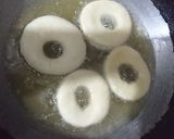 A picture of step 3 of Chocolate Donuts filled with custard.