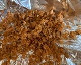 A picture of step 5 of Pla Hang Tang Mo. Watermelon with sweet and salty salmon flakes.