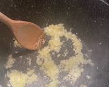 A picture of step 2 of Mdardara - brown lentils and rice with fried onions.