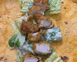 A picture of step 3 of Chicken Cesar salad wrap.