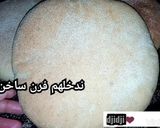 صورة لخطوة 3 من وصفة خبز السميد في الفرن اخف من الريشه