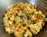 A picture of step 2 of Gobhi with raw turmeric.