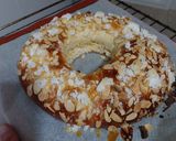 A picture of step 5 of Roscón de Reyes 2025 v2: With Almonds, Sugar, and Whipped Cream Filling.