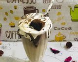 A picture of step 5 of Leftovers brownie/ chocolate cake shake.