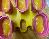 A picture of step 3 of Mango yoghurt Popsicles.