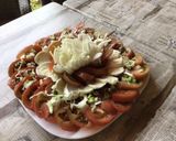 Une image de l'étape 8 de Salade de tomates noires, mozzarella di buffala et oignons nouveaux.