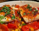 A picture of step 4 of Smokey Cod, Tomato and Chickpea Tray Bake.