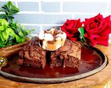 A picture of step 7 of Sizzler Fudge Brownie With Homemade Chocolate Sauce.