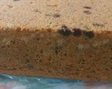 A picture of step 6 of Vanilla with chocolate chips cake and chocolate vermicelli drips.
