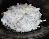 A picture of step 2 of Runner beans and potato fry with onion and onion greens.