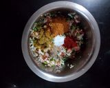 A picture of step 2 of Rava Uttapam with veggies, packed with fruits and dryfruits.