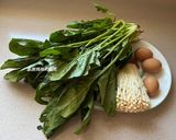 A picture of step 1 of Spinach and Enoki Mushrooms with Eggs.