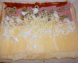 Foto del paso 7 de la receta: Pionono de jamón, queso, morrón, huevo y aceitunas