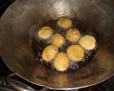 A picture of step 7 of Mandazi with cardamom pods #favoritekidsrecipe.