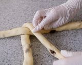 A picture of step 10 of Soft Chewy Braided Raisin Bread.