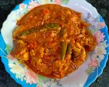 A picture of step 7 of Achari chicken.