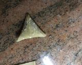 A picture of step 7 of Samosa and a chutney.