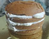 A picture of step 9 of White Forest Football cake.